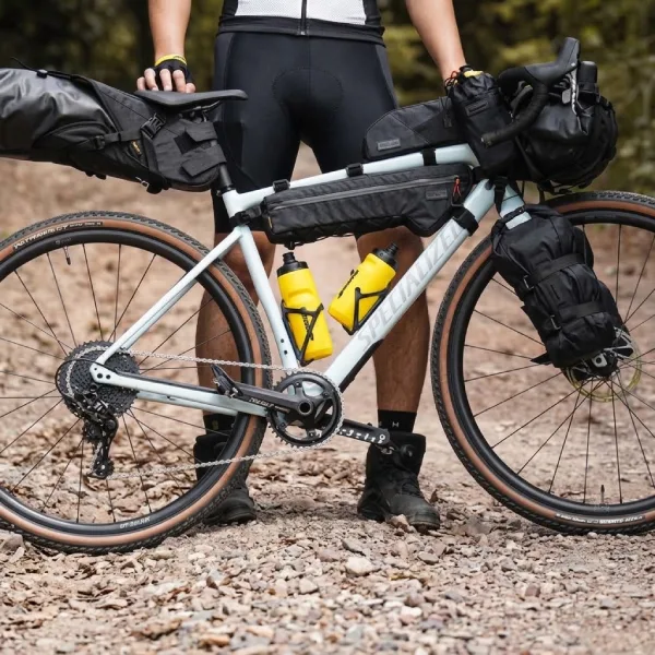 Cyclist with a Rhinowalk frame bag and bikepacking bags loaded on a gravel bike